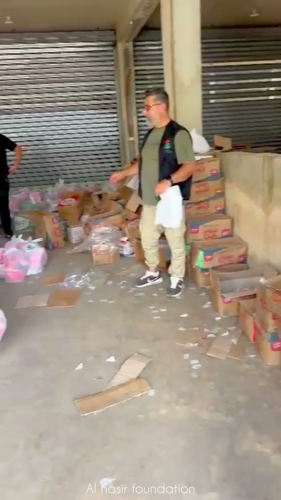 Al Nasir Foundation volunteer sorting donated supplies