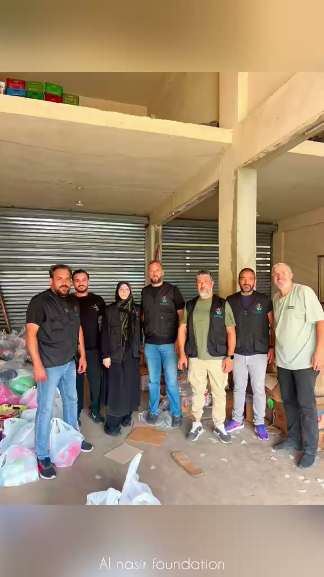 Al Nasir Foundation volunteers and board members at a distribution warehouse